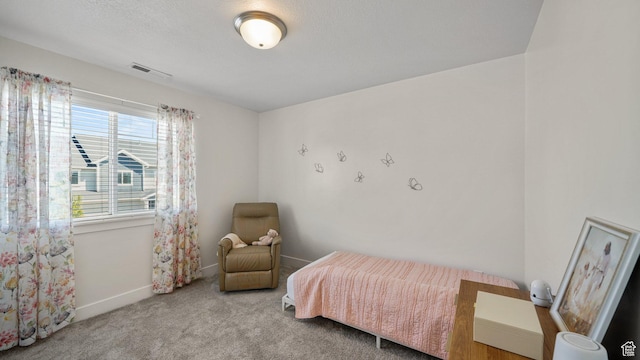 carpeted bedroom with baseboards