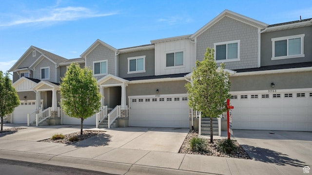 view of front of property featuring an attached garage and concrete driveway