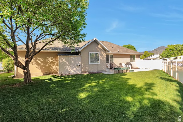 1186 E 470 S, Payson, UT 84651 - rear view of house featuring stucco siding, a shingled roof, and a patio area