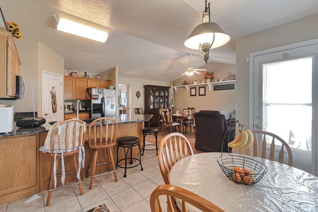 1186 E 470 S, Payson, UT 84651 - dining space with light tile patterned floors, a ceiling fan, and vaulted ceiling