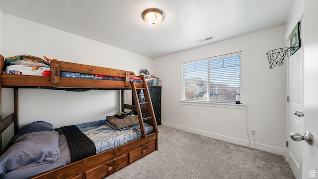 carpeted bedroom with baseboards