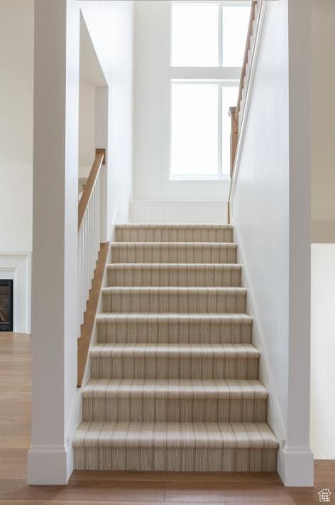 405 W 1200 N Unit 4, Mapleton, UT 84664 - stairway featuring wood finished floors and a glass covered fireplace