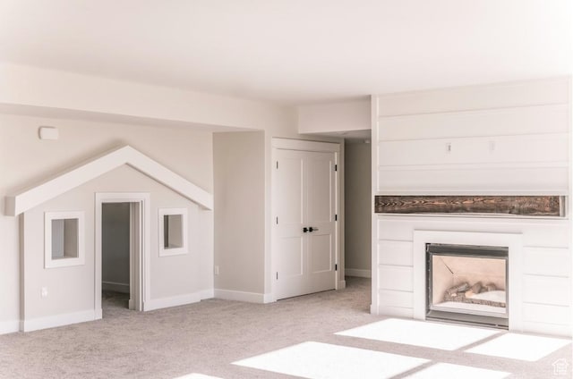 443 W 1200 N Unit 3, Mapleton, UT 84664 - unfurnished living room with light carpet, baseboards, and a fireplace
