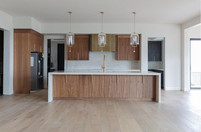 443 W 1200 N Unit 3, Mapleton, UT 84664 - kitchen with freestanding refrigerator, light countertops, and light wood finished floors