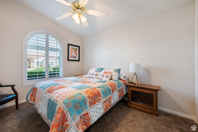 bedroom with carpet flooring, lofted ceiling, baseboards, and a ceiling fan
