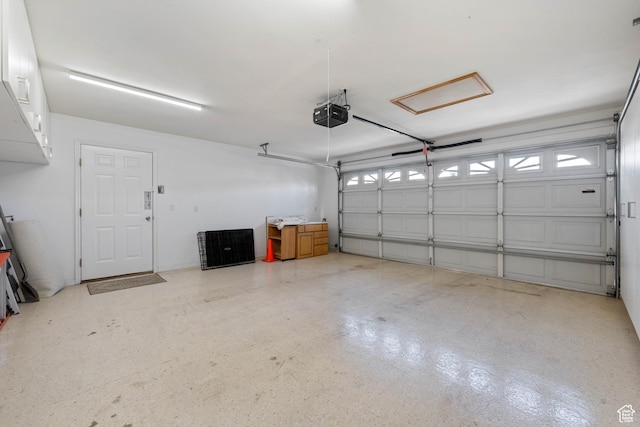 garage featuring a garage door opener