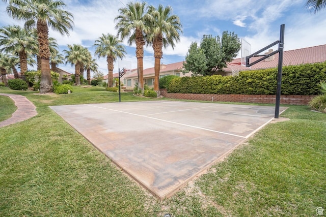 view of sport court featuring community basketball court and a yard