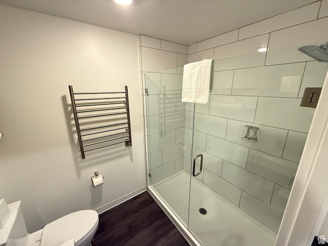 2670 Canyons Resort Dr Unit 129, Park City, UT 84098 - full bathroom with radiator heating unit, wood finished floors, toilet, a stall shower, and baseboards