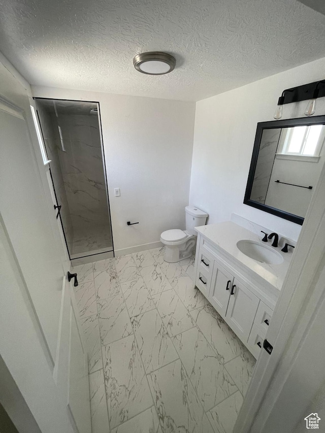 1426 W Carlos Dr S, West Valley City, UT 84119 - bathroom with marble finish flooring, walk in shower, toilet, vanity, and a textured ceiling