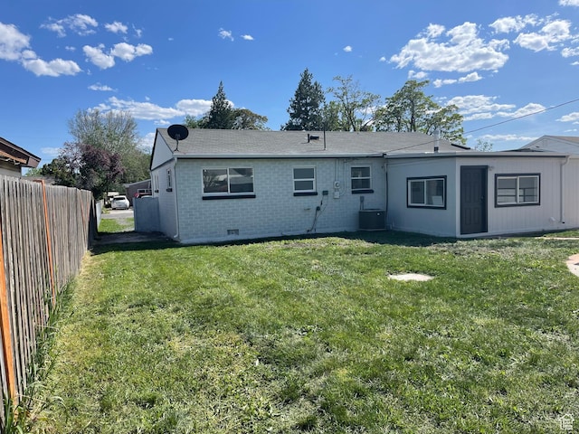 1426 W Carlos Dr S, West Valley City, UT 84119 - rear view of house with brick siding, crawl space, and central AC unit