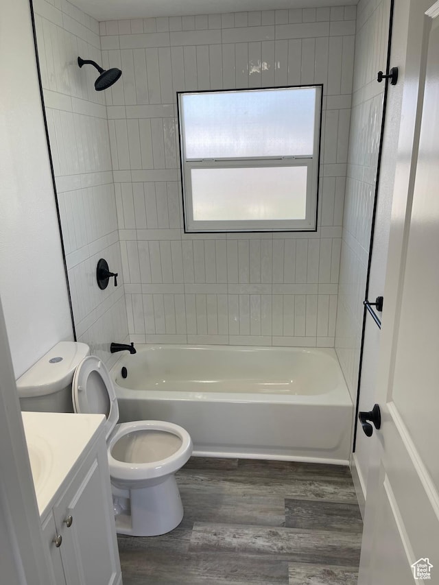 1426 W Carlos Dr S, West Valley City, UT 84119 - full bath with wood finished floors, toilet, vanity, and bathtub / shower combination