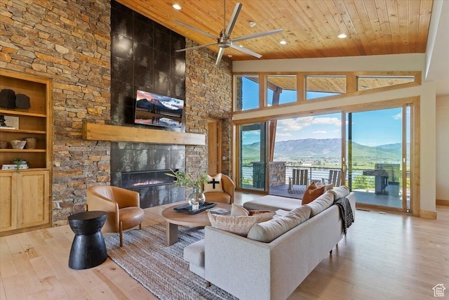 1108 N Lakeside Ct, Eden, UT 84310 - living area featuring wood ceiling, wood-type flooring, a large fireplace, ceiling fan, and recessed lighting