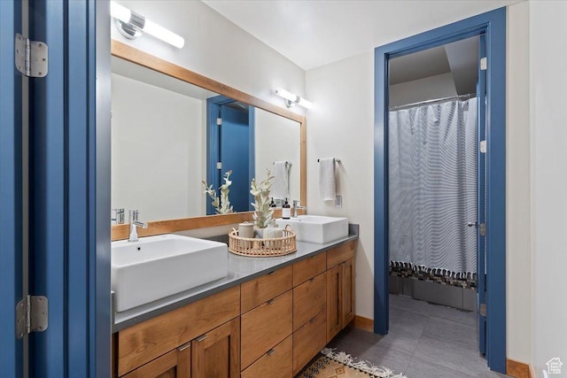 1108 N Lakeside Ct, Eden, UT 84310 - bathroom with double vanity, tile patterned flooring, and baseboards