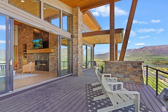 1108 N Lakeside Ct, Eden, UT 84310 - deck featuring an outdoor stone fireplace