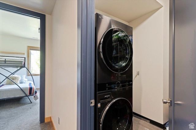 1108 N Lakeside Ct, Eden, UT 84310 - laundry area with stacked washer / drying machine, baseboards, and carpet floors