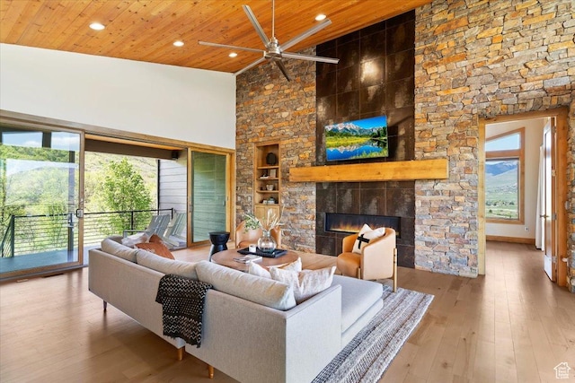 1108 N Lakeside Ct, Eden, UT 84310 - living room with ceiling fan, wooden ceiling, built in shelves, a fireplace, and recessed lighting
