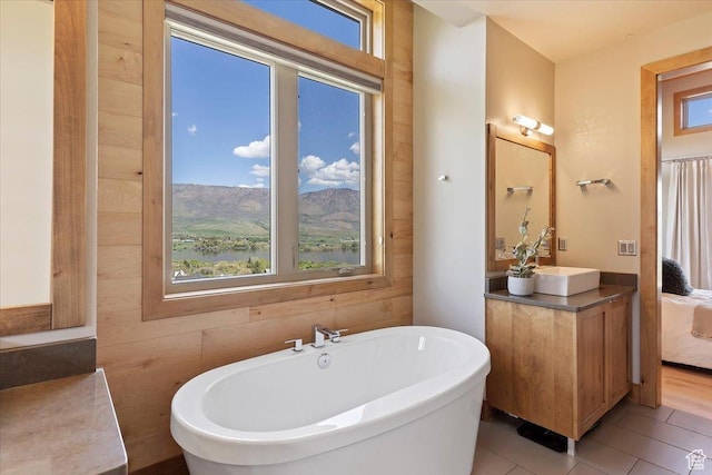 1108 N Lakeside Ct, Eden, UT 84310 - full bath featuring plenty of natural light, a freestanding bath, vanity, and tile patterned floors