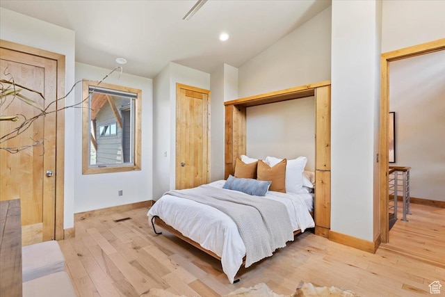 1108 N Lakeside Ct, Eden, UT 84310 - bedroom featuring light wood-style floors and baseboards