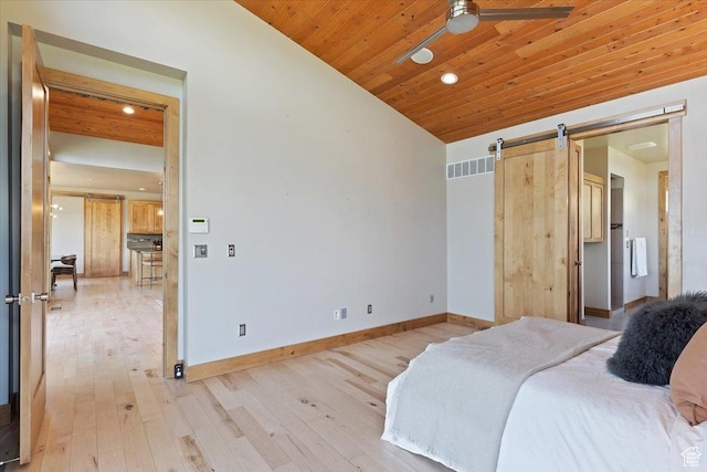 1108 N Lakeside Ct, Eden, UT 84310 - bedroom featuring a barn door, light wood-style flooring, recessed lighting, baseboards, and lofted ceiling