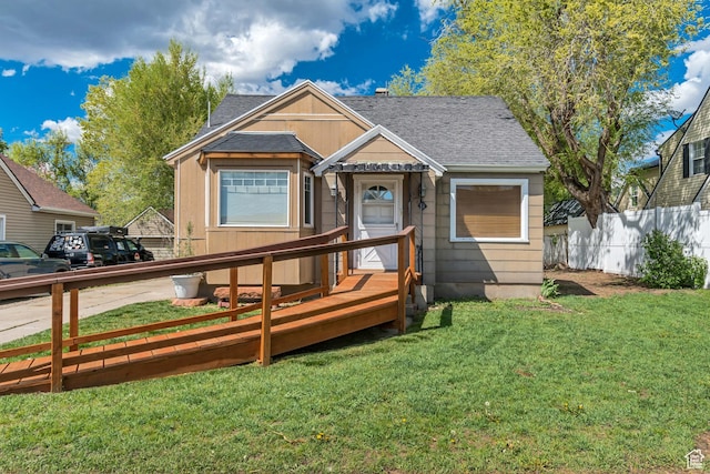 view of front of property featuring roof with shingles