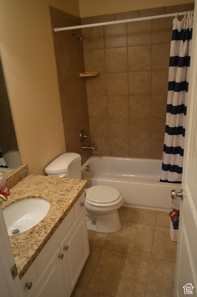 bathroom with toilet, shower / bath combination with curtain, vanity, and tile patterned flooring