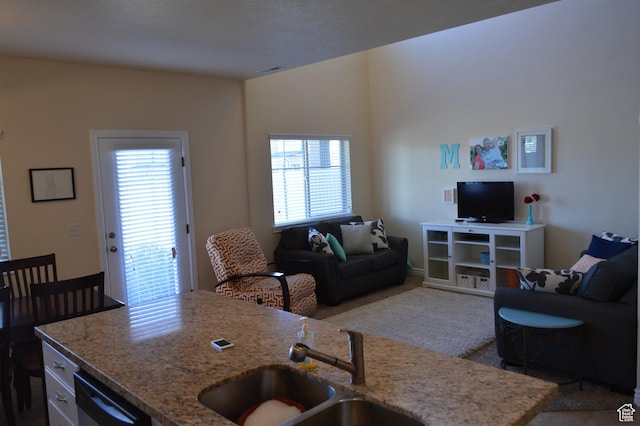 living area with light carpet