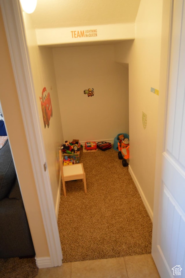 playroom with light carpet and baseboards