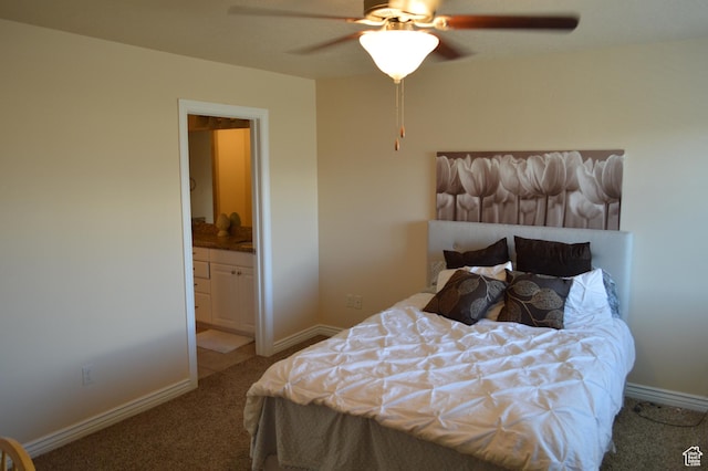 bedroom featuring carpet flooring, ensuite bath, baseboards, and a ceiling fan