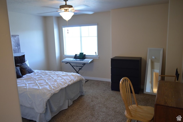 bedroom featuring carpet, baseboards, and ceiling fan