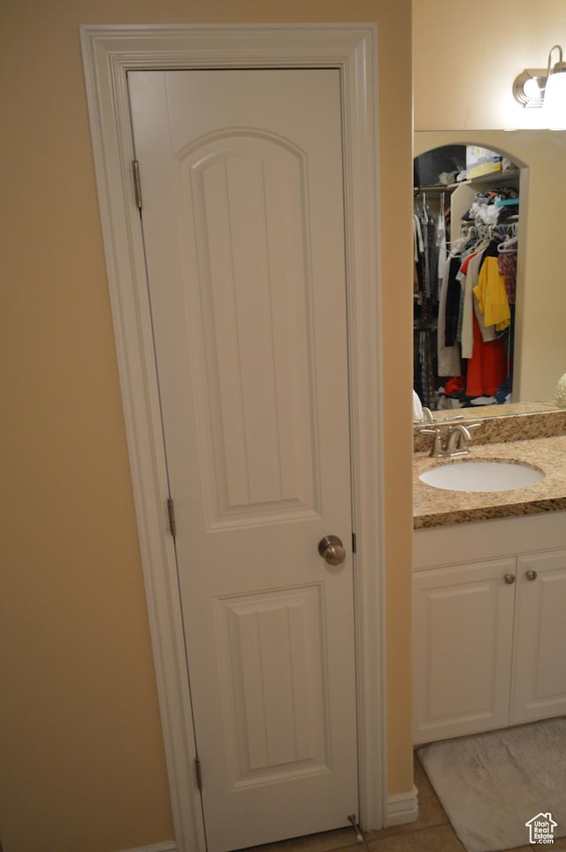 bathroom featuring vanity and tile patterned flooring