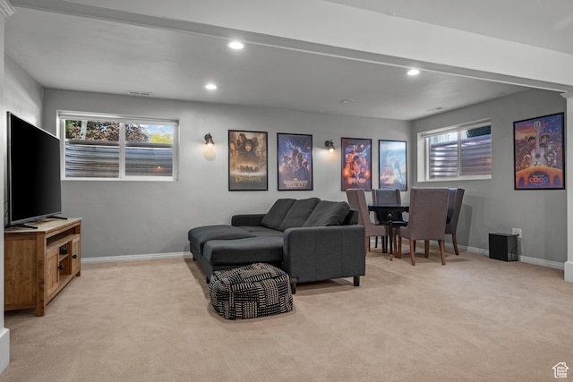 living area featuring light carpet, baseboards, and recessed lighting