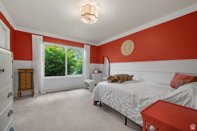 carpeted bedroom featuring crown molding