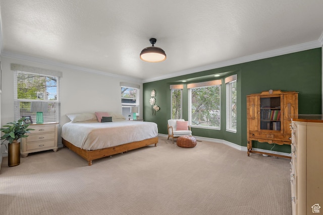 carpeted bedroom with crown molding and baseboards