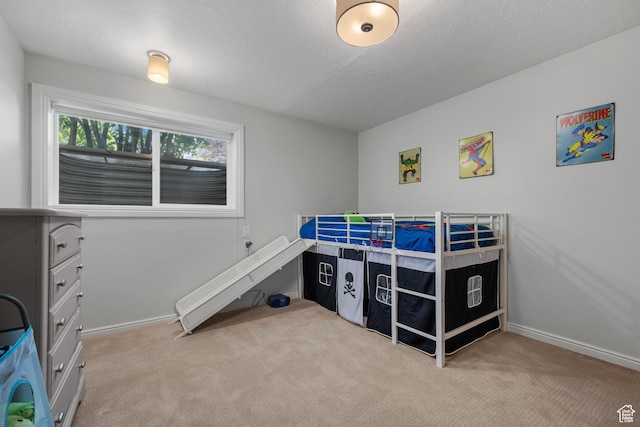 bedroom featuring carpet flooring and baseboards