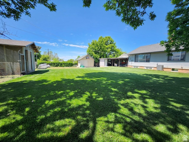 628 E 150 S, Kaysville, UT 84037 - view of grassy yard featuring an outbuilding
