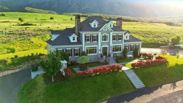 6071 W 1800 S, Mendon, UT 84325 - neoclassical home with a chimney and a rural view