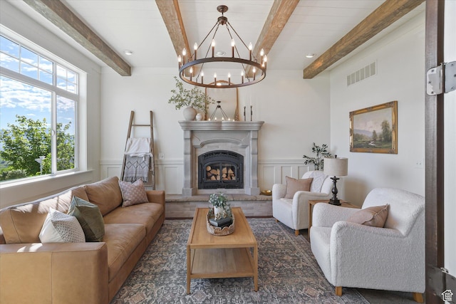 6071 W 1800 S, Mendon, UT 84325 - living room with beamed ceiling, a chandelier, a high end fireplace, a decorative wall, and a wainscoted wall