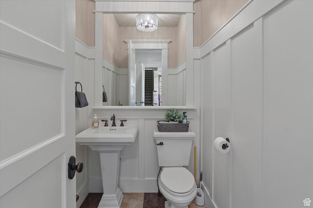 6071 W 1800 S, Mendon, UT 84325 - half bath with a decorative wall, toilet, and a wainscoted wall