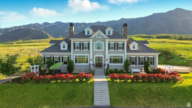 6071 W 1800 S, Mendon, UT 84325 - colonial inspired home featuring a chimney, a mountain view, and a front lawn