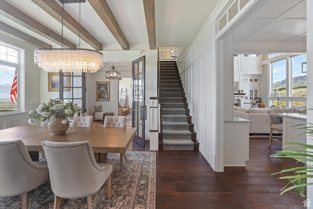 6071 W 1800 S, Mendon, UT 84325 - dining area featuring dark wood-style flooring, stairs, a chandelier, plenty of natural light, and beamed ceiling