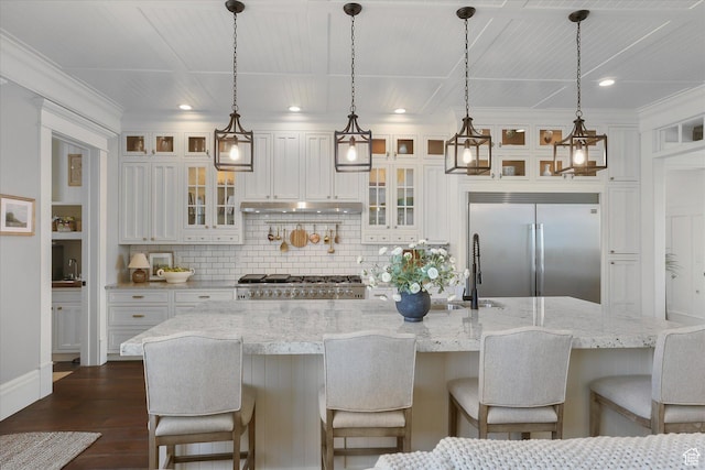 6071 W 1800 S, Mendon, UT 84325 - kitchen featuring stainless steel built in fridge, white cabinets, stove, backsplash, and a large island with sink