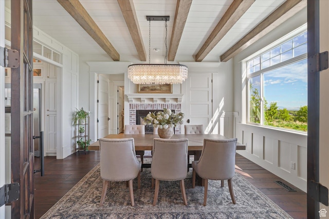 6071 W 1800 S, Mendon, UT 84325 - dining space featuring beam ceiling, dark wood finished floors, a decorative wall, and a chandelier