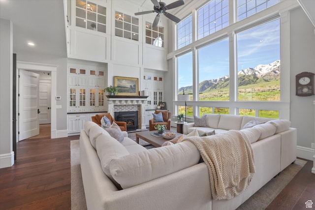 6071 W 1800 S, Mendon, UT 84325 - living room featuring baseboards, a high ceiling, dark wood-type flooring, a ceiling fan, and recessed lighting