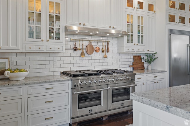 6071 W 1800 S, Mendon, UT 84325 - kitchen with high quality appliances, under cabinet range hood, white cabinets, and decorative backsplash