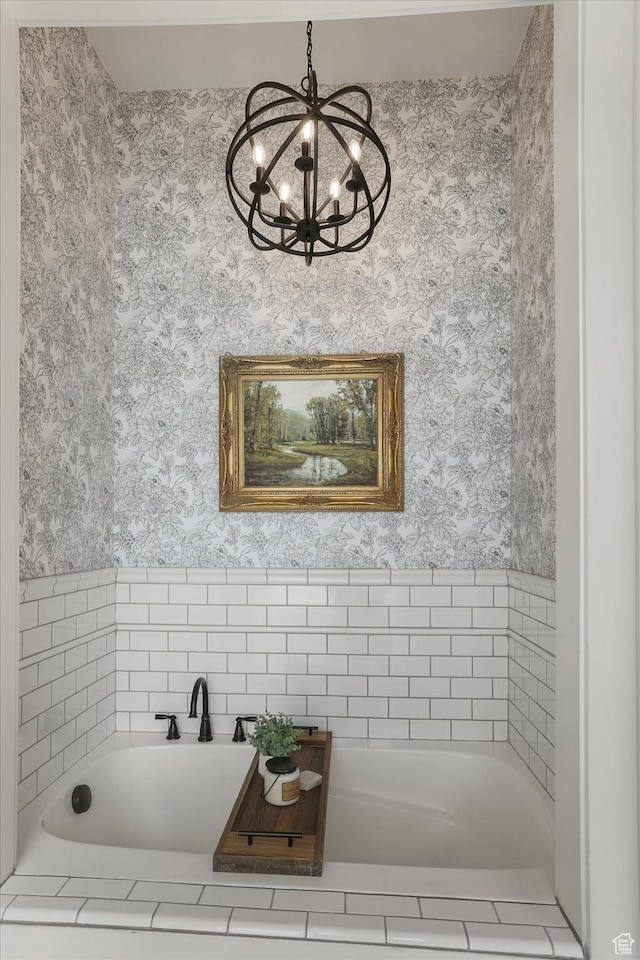 6071 W 1800 S, Mendon, UT 84325 - bathroom featuring wallpapered walls, a chandelier, and a tub