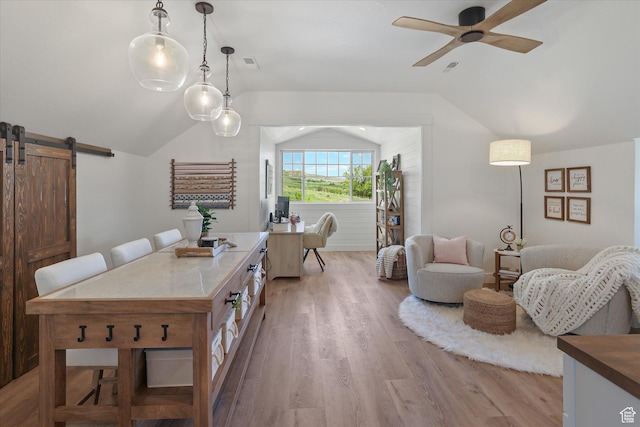 6071 W 1800 S, Mendon, UT 84325 - dining space with a barn door, vaulted ceiling, a ceiling fan, and light wood-style floors