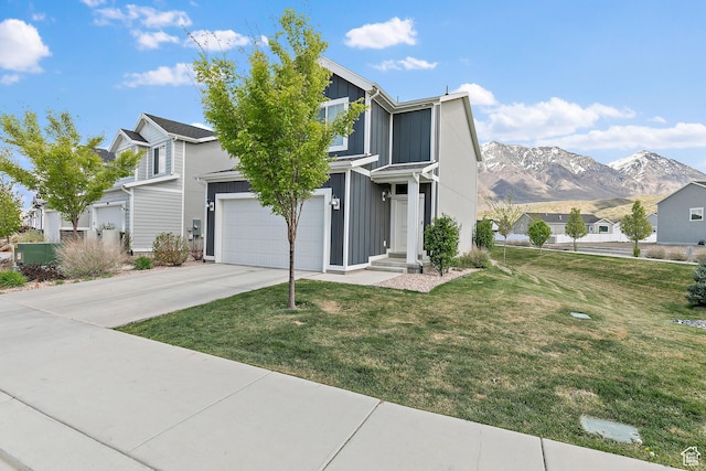895 S Brubaker Way, Santaquin, UT 84655 - traditional home with board and batten siding, concrete driveway, a mountain view, and a front lawn