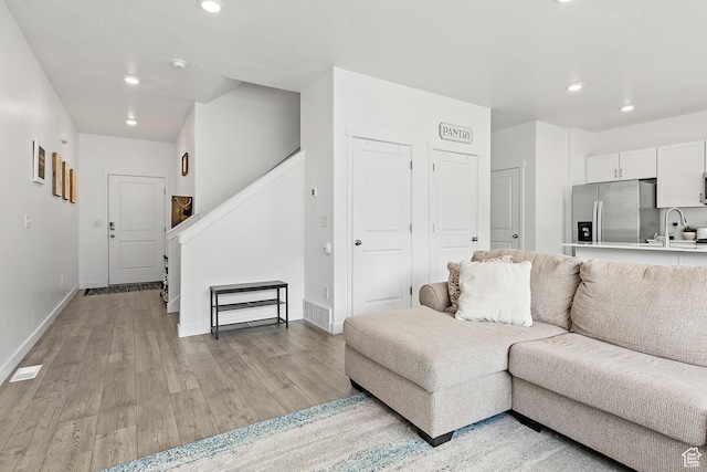 895 S Brubaker Way, Santaquin, UT 84655 - living area featuring recessed lighting, light wood-type flooring, stairway, and baseboards