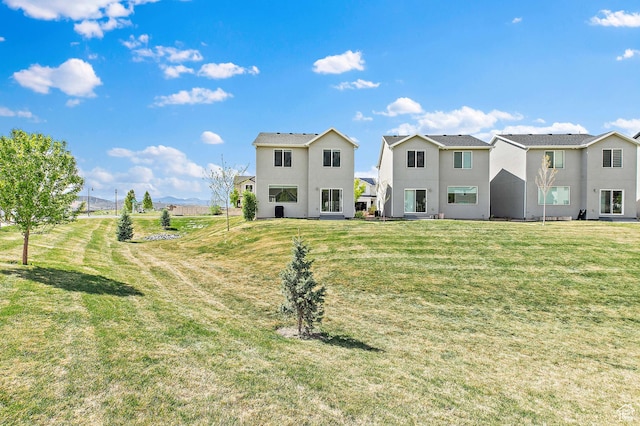895 S Brubaker Way, Santaquin, UT 84655 - rear view of house with stucco siding and a lawn