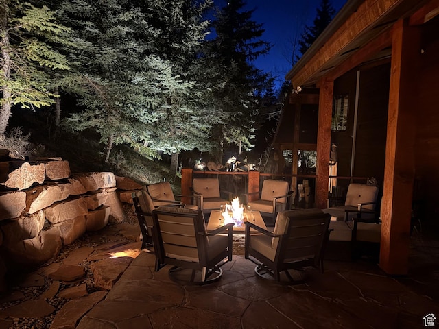 3321 W Big Spruce Way Unit E54, Park City, UT 84098 - patio at night with an outdoor fire pit